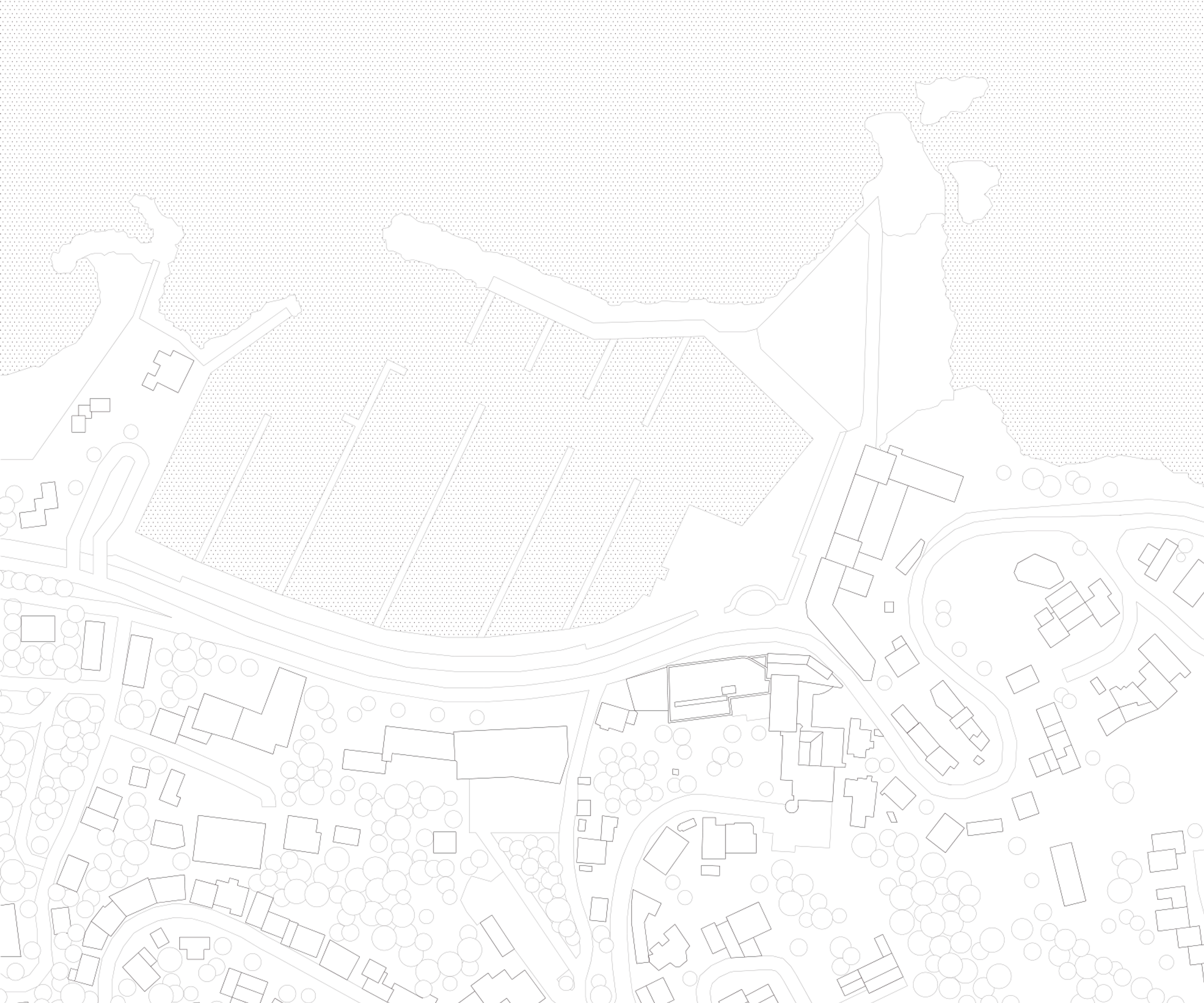 Plan masse du Biodiversarium à Banyuls-sur-Mer, inséré entre falaise et port, montrant le volume compact en front de quai et son articulation au tissu urbain.