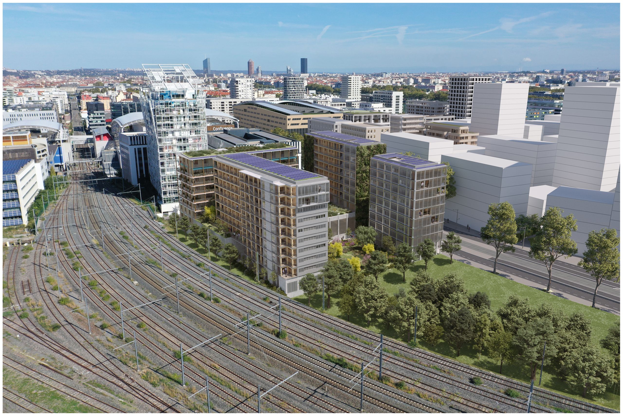 Vue aérienne de l’îlot E4 Nord à Lyon : volumes en U, façades tramées et toitures solaires entre voies ferrées, rue et jardin humide.