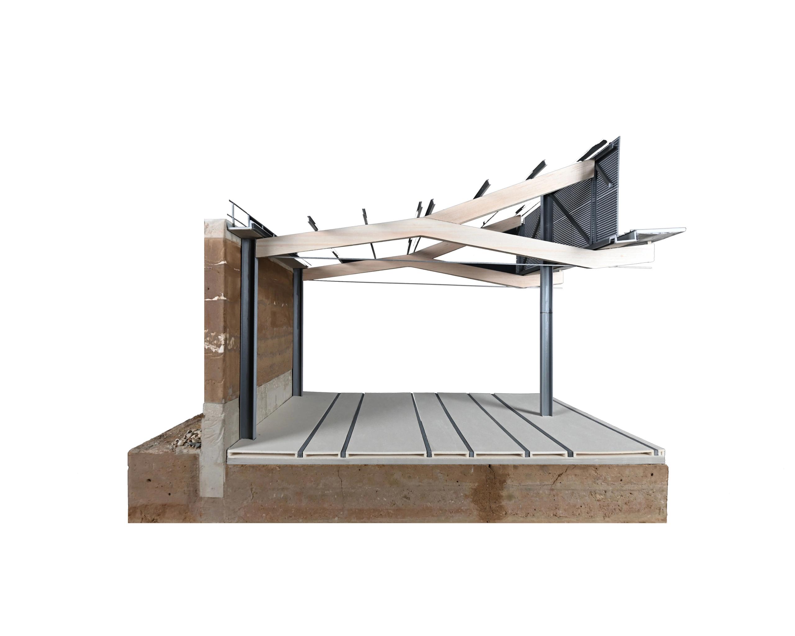 Vue de maquette de détail constructif du centre de maintenance de tramway à Lyon, montrant une coupe transversale : socle en terre compactée, dalle de sol préfabriquée avec réservations longitudinales, poteaux métalliques porteurs, paroi latérale en béton et terre crue, et toiture légère composée de poutres bois croisées supportant une peau technique en panneaux nervurés, illustrant la structure et l’assemblage des matériaux du projet Tectoniques.