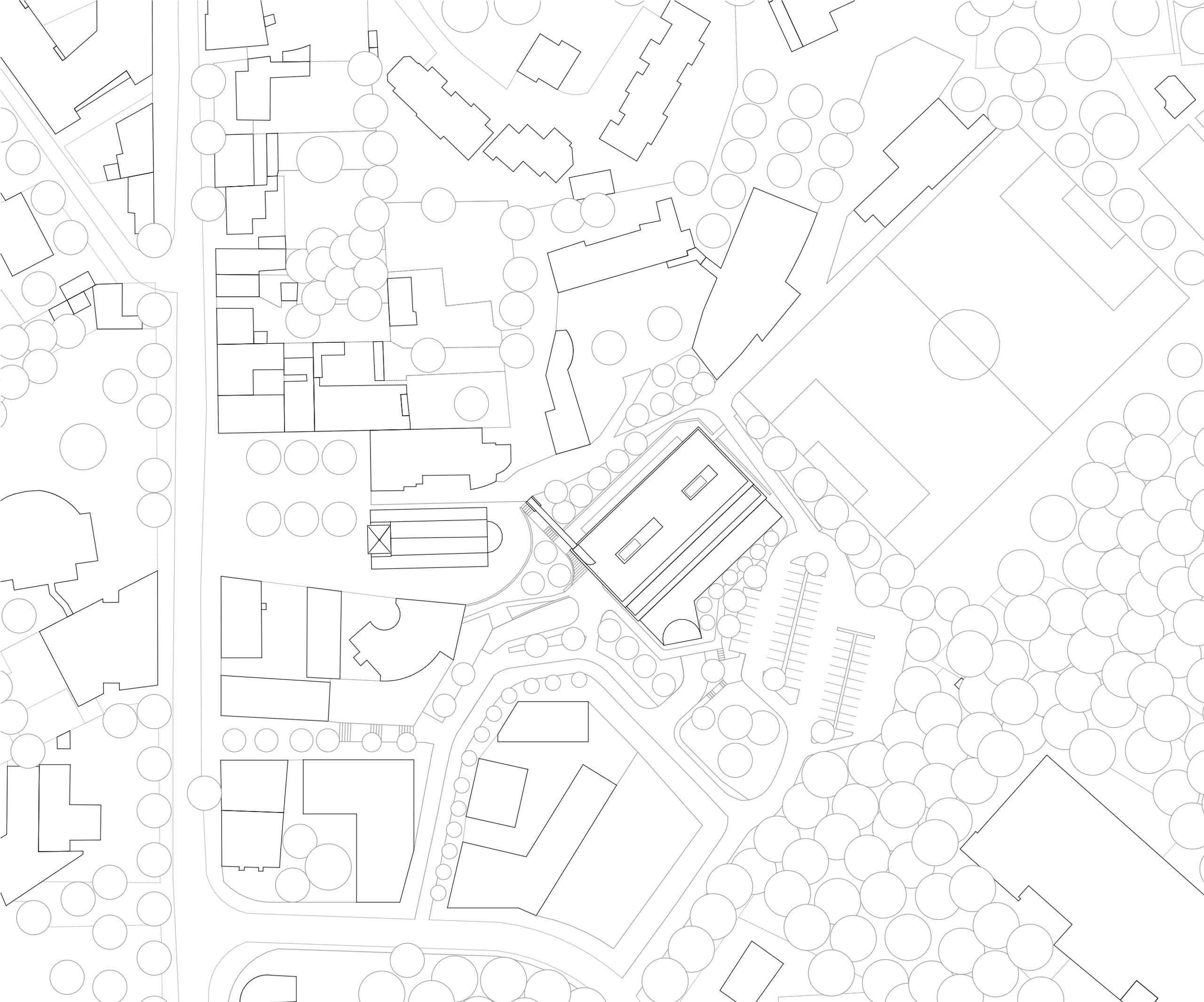 Plan masse de la Maison des familles à Limonest, volume tellurique en terrasses articulant parking, crèche et locaux associatifs dans le tissu urbain et paysager.