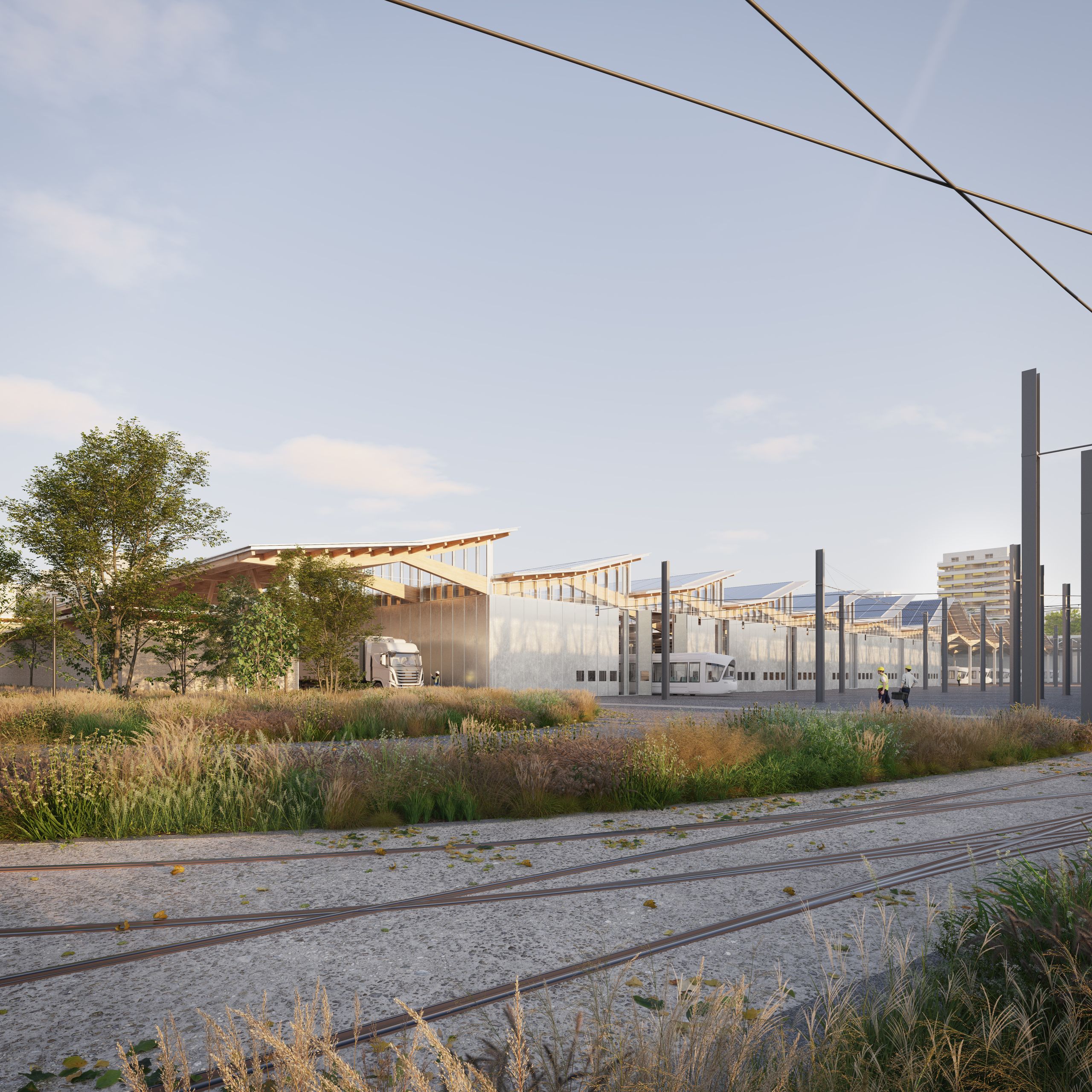 Centre de maintenance des tramways à Lyon : hall à travées répétitives, charpente bois, sheds photovoltaïques, voies ferrées et noues paysagères.