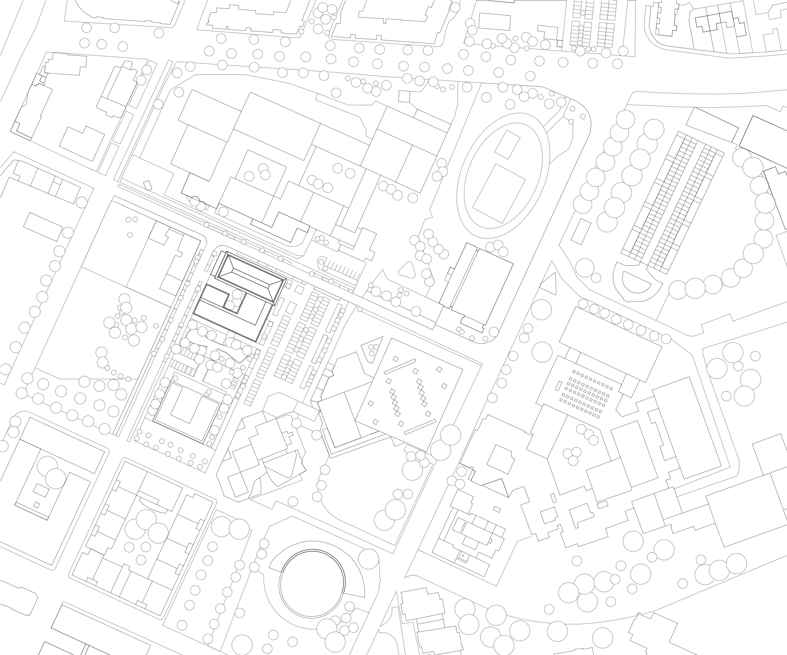 Plan masse de la Cité campus Assia Djebar à Vaulx-en-Velin, montrant l’implantation compacte du bâtiment au centre du tissu urbain et des équipements voisins.