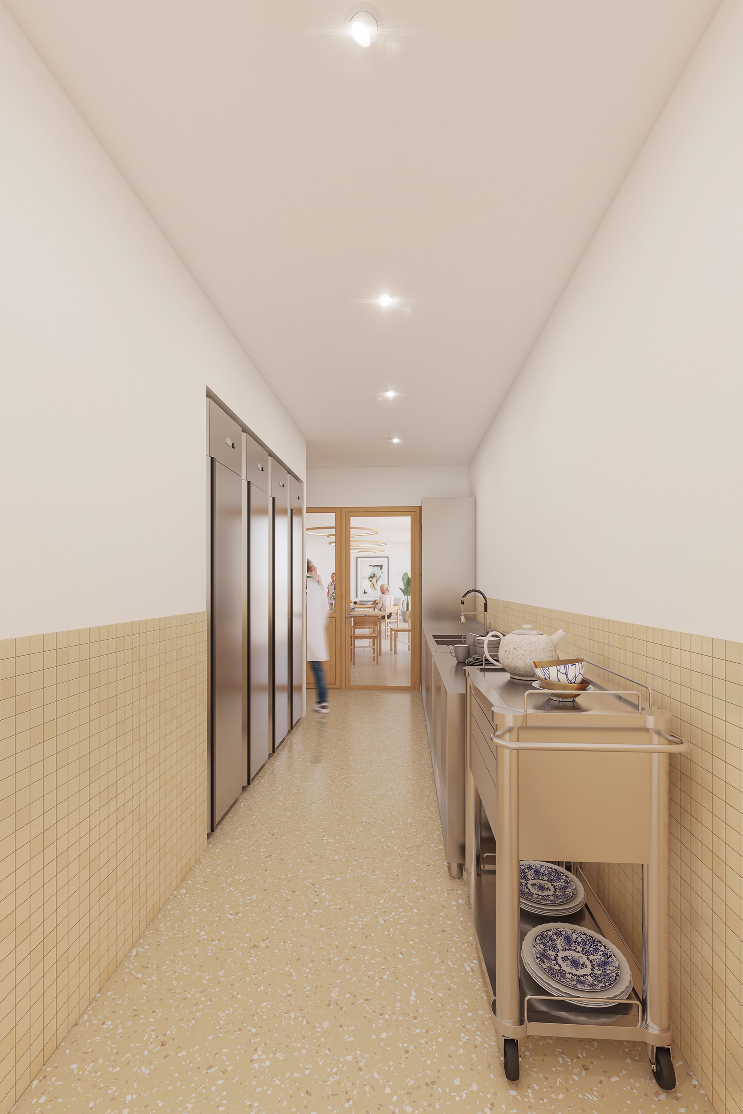 Office de l’Ehpad d’Auxerre : parois carrelées, sol souple, équipements en inox et porte vitrée ouvrant sur la salle à manger.