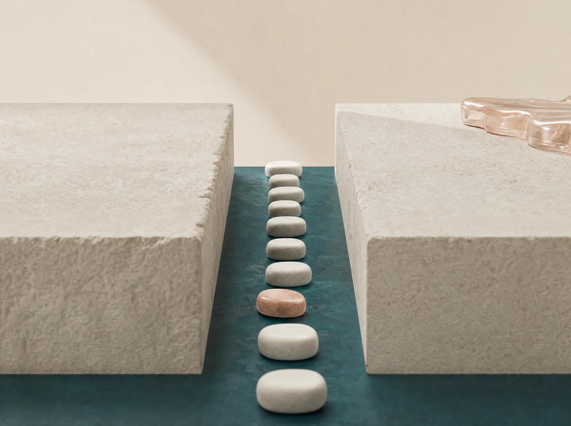A line of tactile stepping stones bridging the gap between two large customer-experience surfaces.