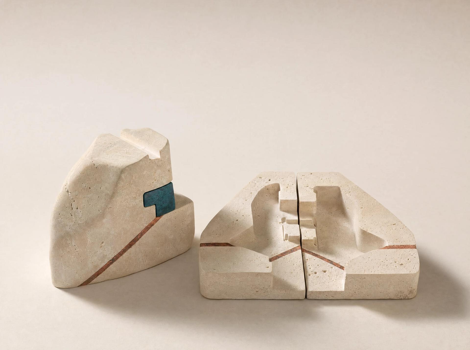 An irregular limestone casting beside the recognisable mould cavity that governed its shape.