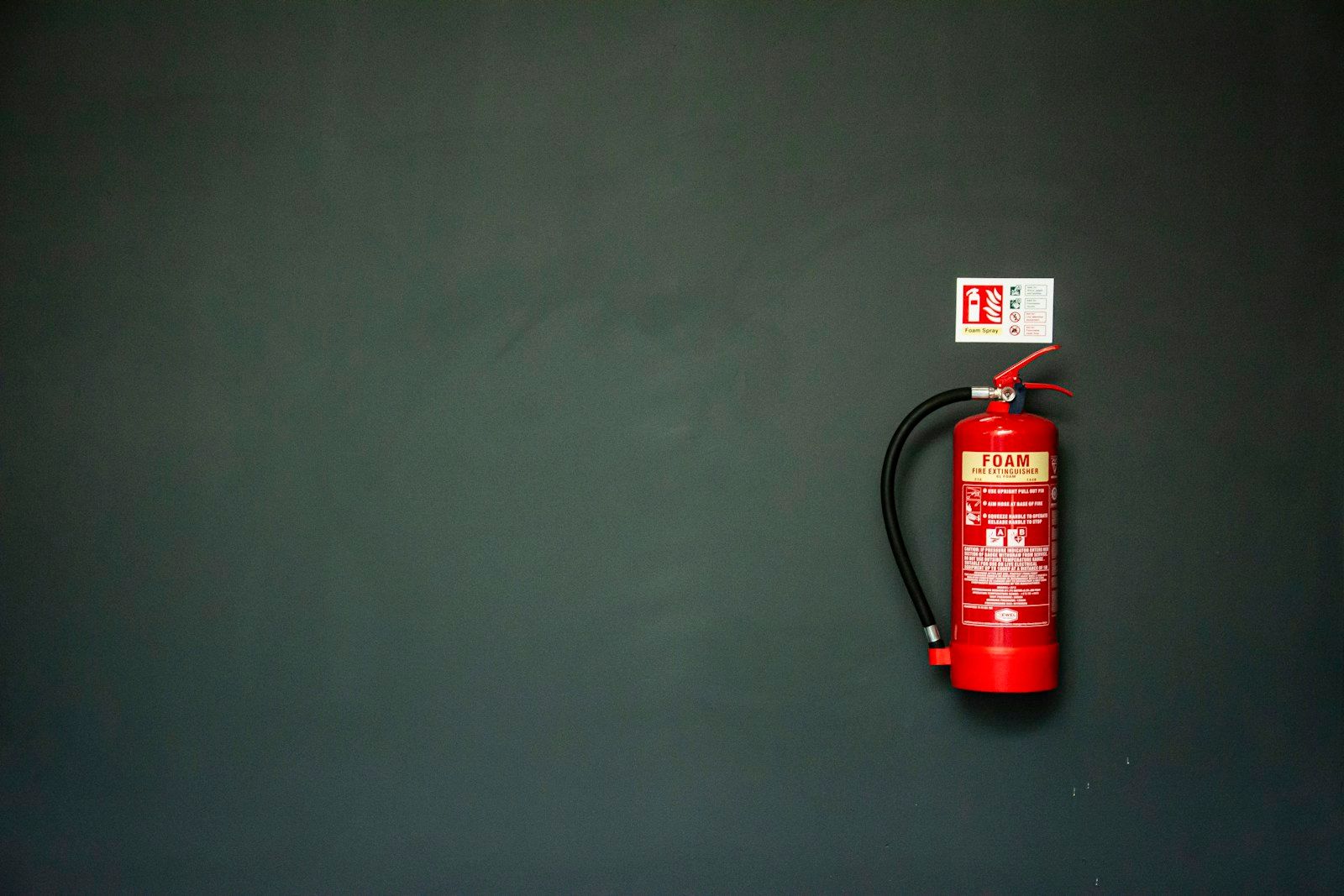 Fire extinguisher on a wall as a reference for safety planning at film locations