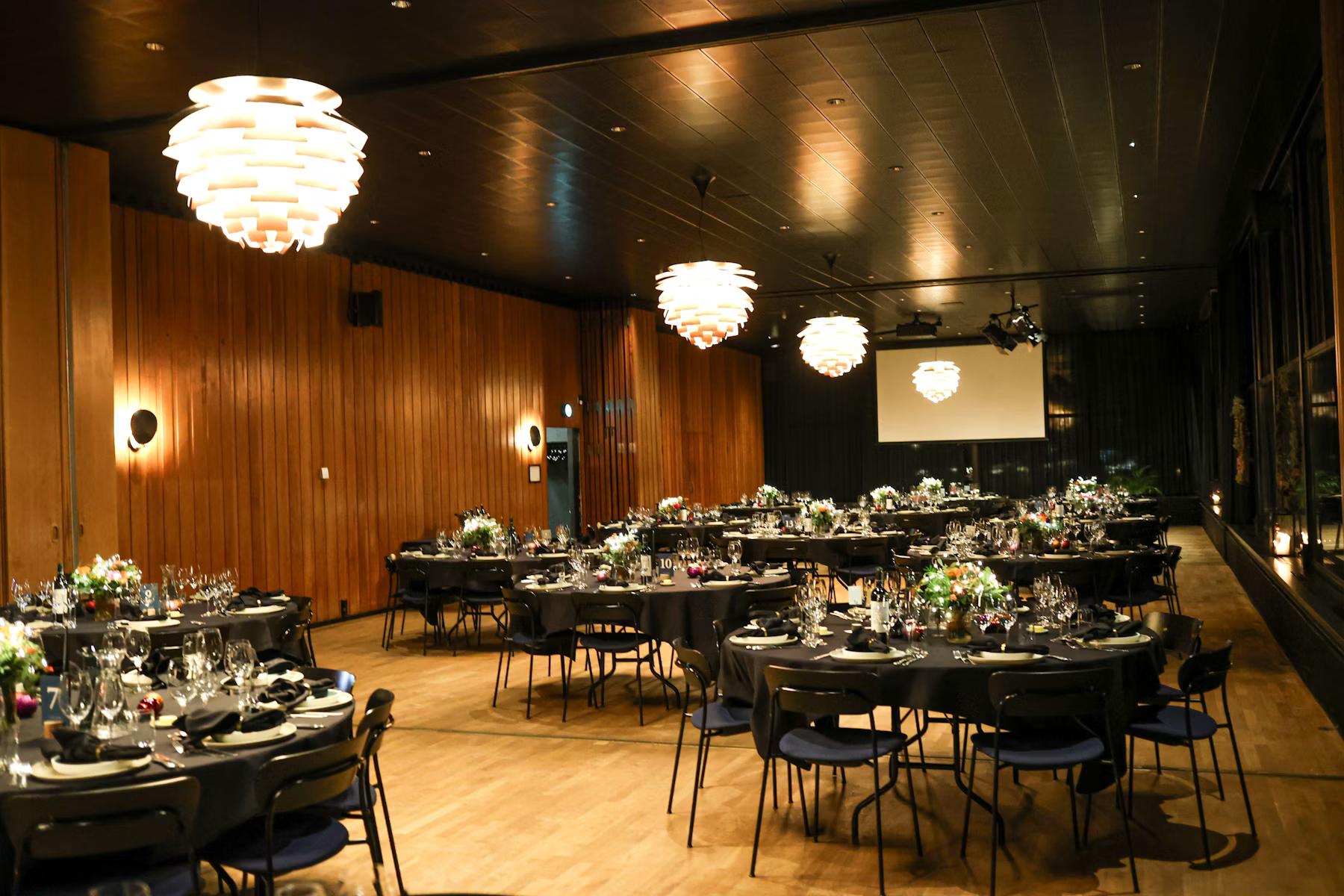 Elegant event venue with round dining tables