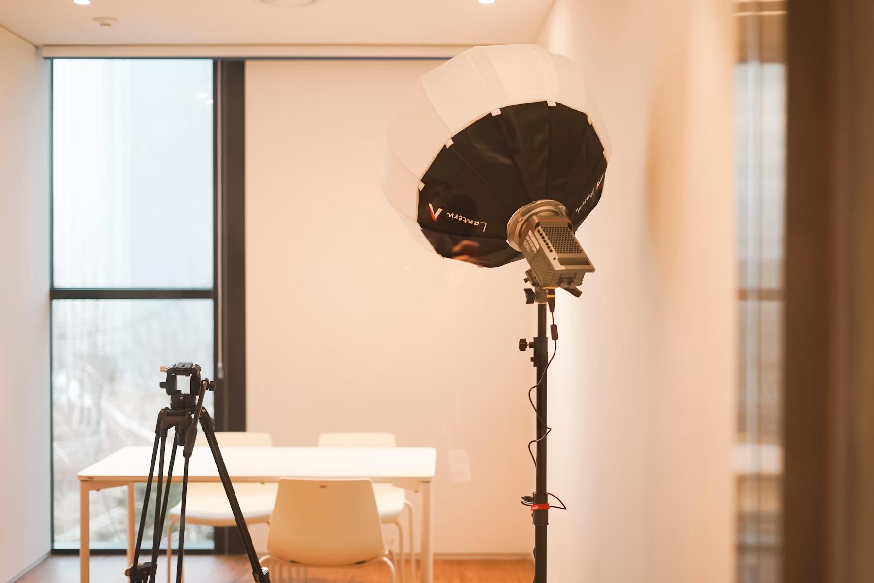 Camera and tripod set up in an interior room