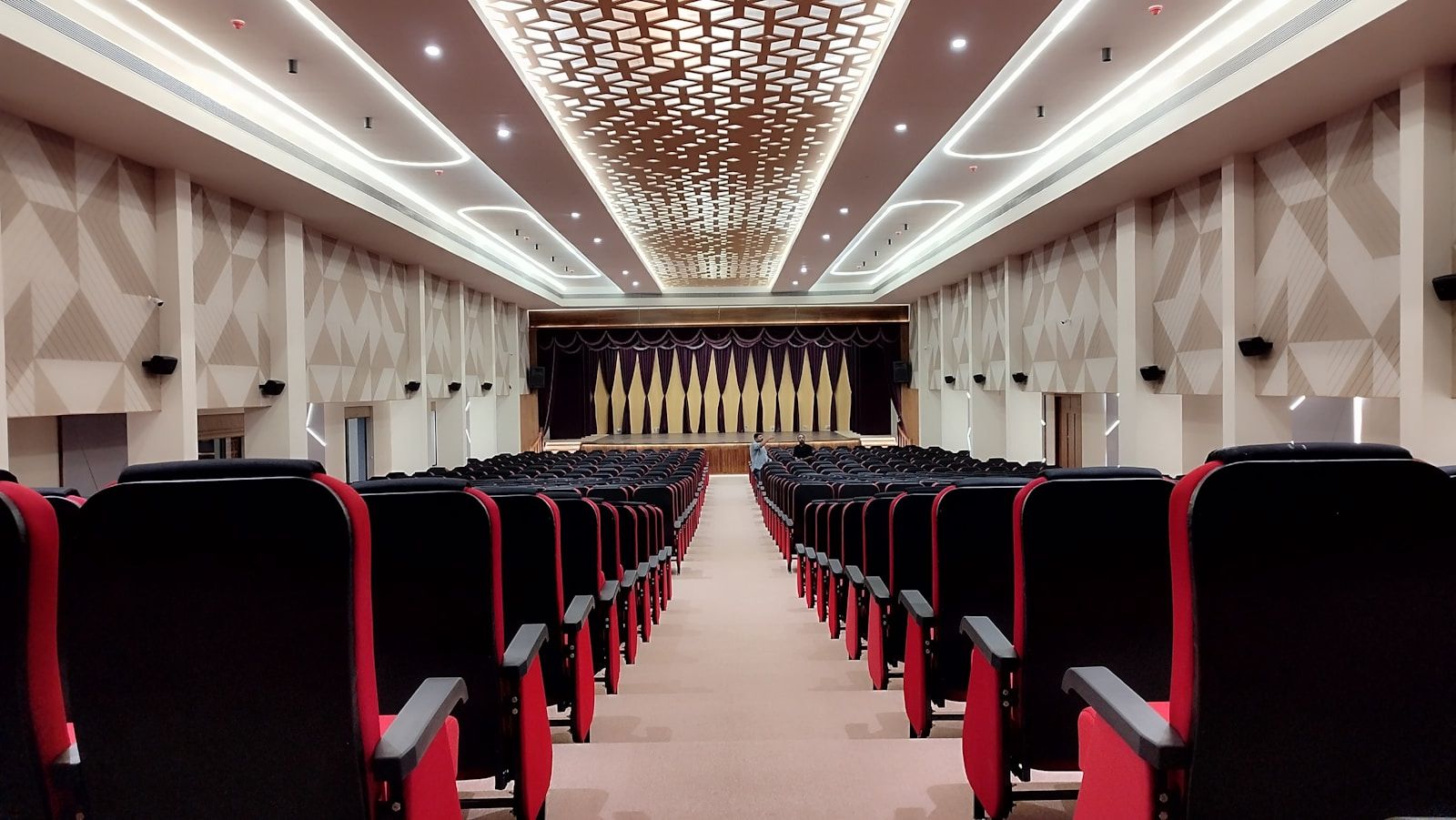 Empty auditorium with stage and rows of seats as an event venue for production checks