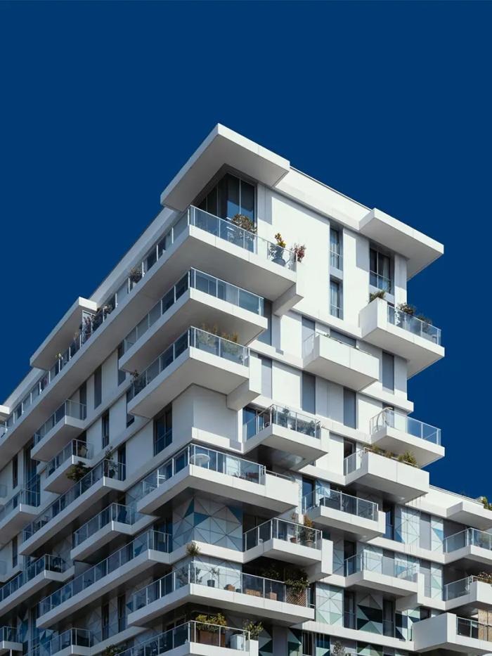 Arkitekttegnet hvid lejlighedskompleks