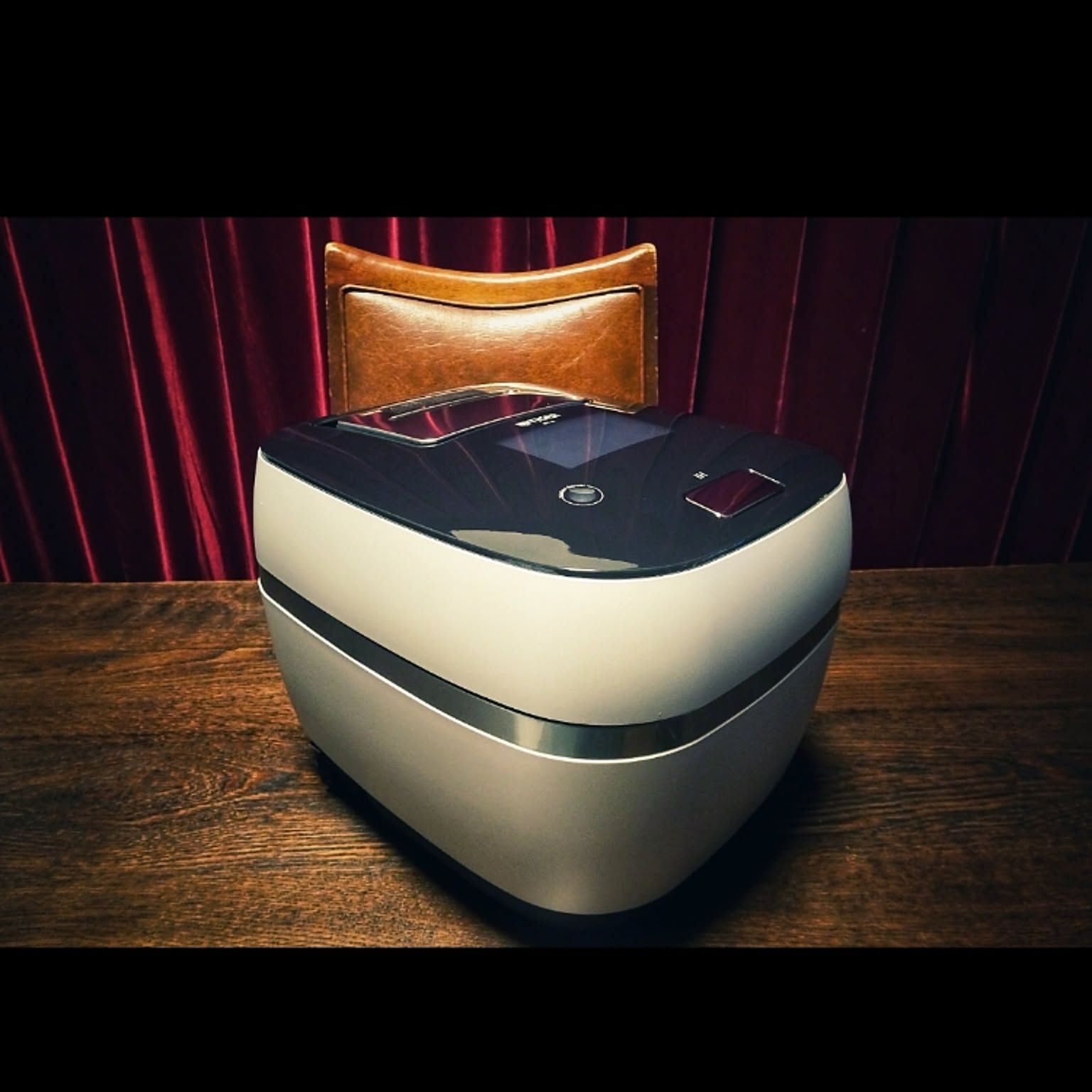 A white Tiger 3.5-cup rice cooker shown close-up on a kitchen counter.