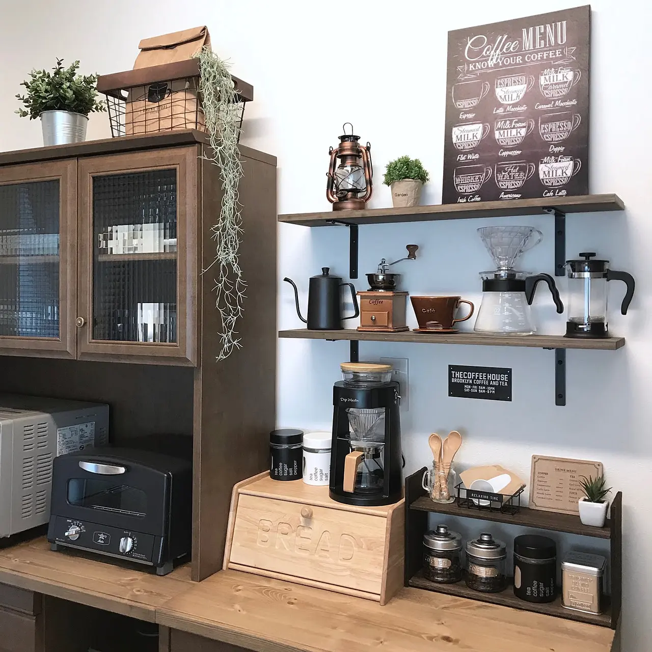 A compact wall-mounted coffee station with a Hario dripper and server in a Japanese kitchen.