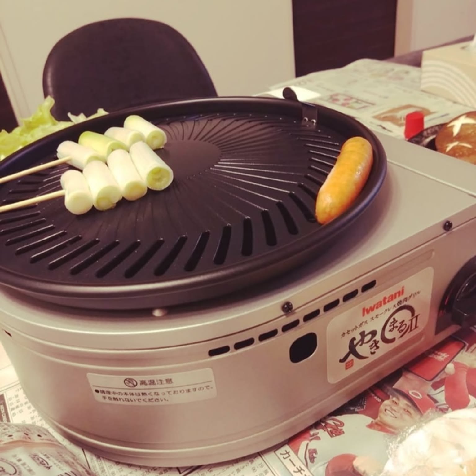 An Iwatani Yakimaru II smokeless yakiniku grill shown close-up on a table.