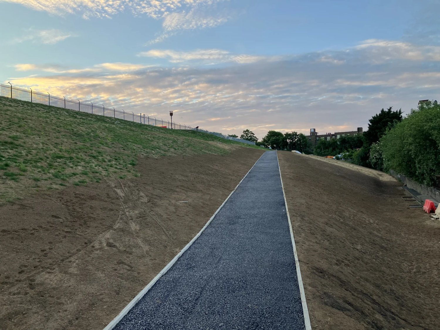 Reprofiled embankment and new footpath at Maiden Lane.