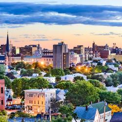 City buildings in downtown Augusta, Maine at sunset