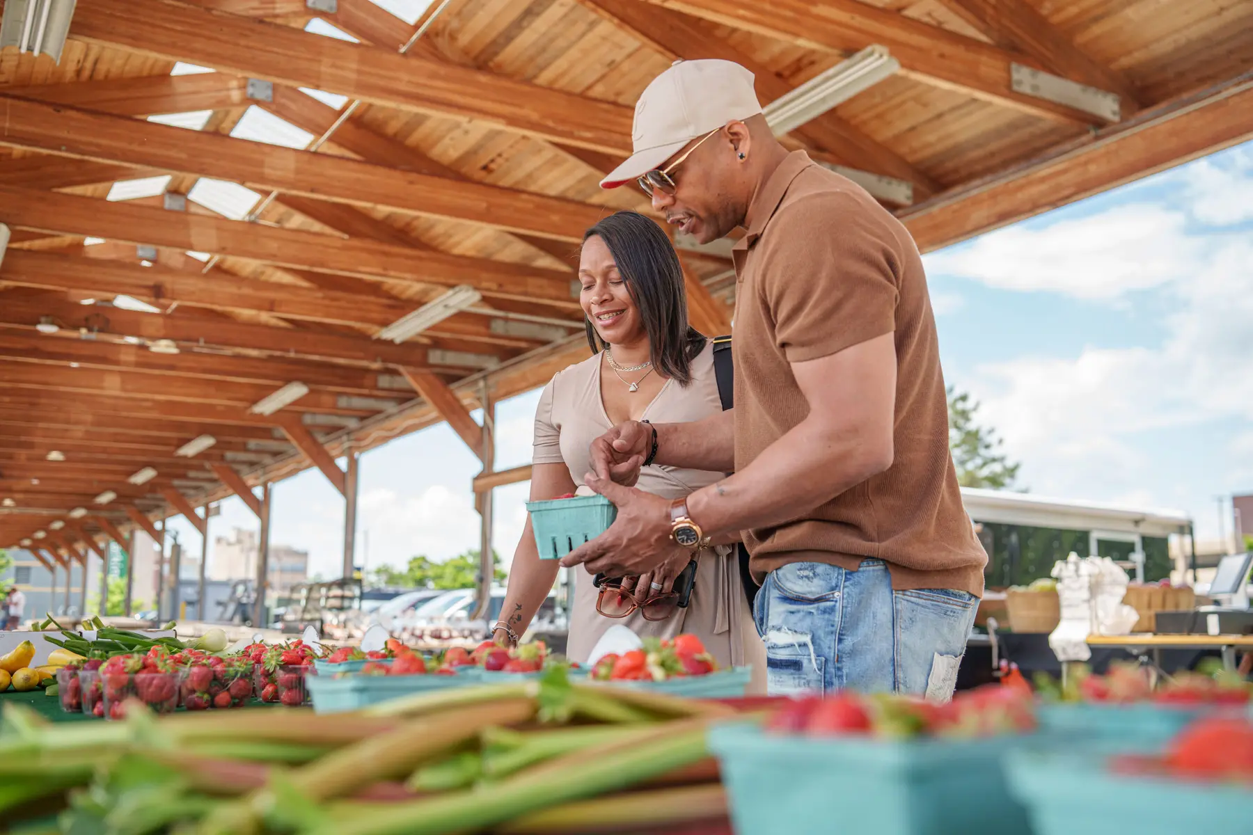 A couple enjoys the Flint Farmers' Market in downtown Flint. (Photo Credit: Flint and Genesee Group)