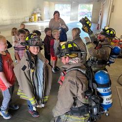 Firefighters interacting with local children 