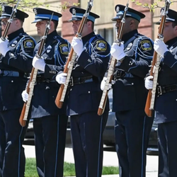 Jackson Police Department officers in formal uniforms for ceremony. 