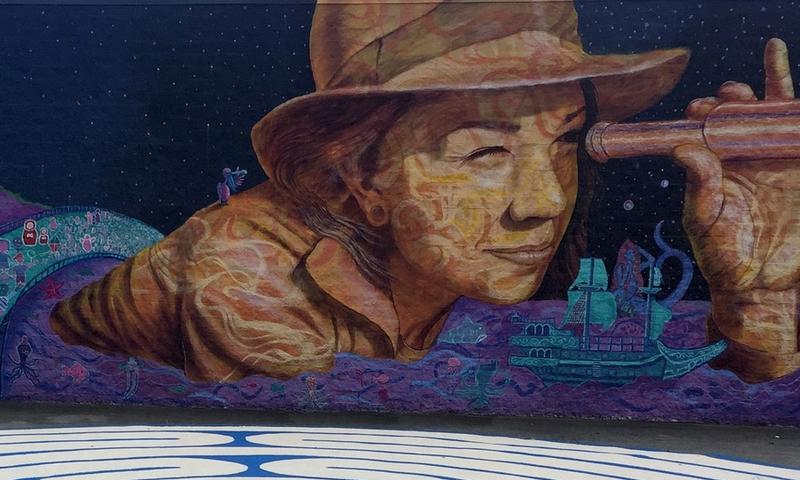 This mural was conceived by HopeCAT students and facilitated and painted by them, the artist Joel, and the volunteers from the arts community. 