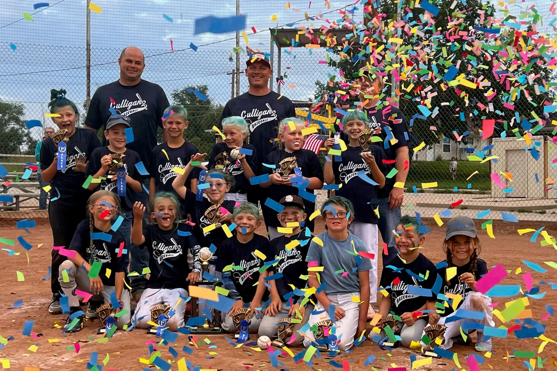 A Decatur County, KS youth baseball team celebrating