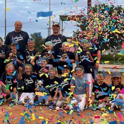 A Decatur County, KS youth baseball team celebrating