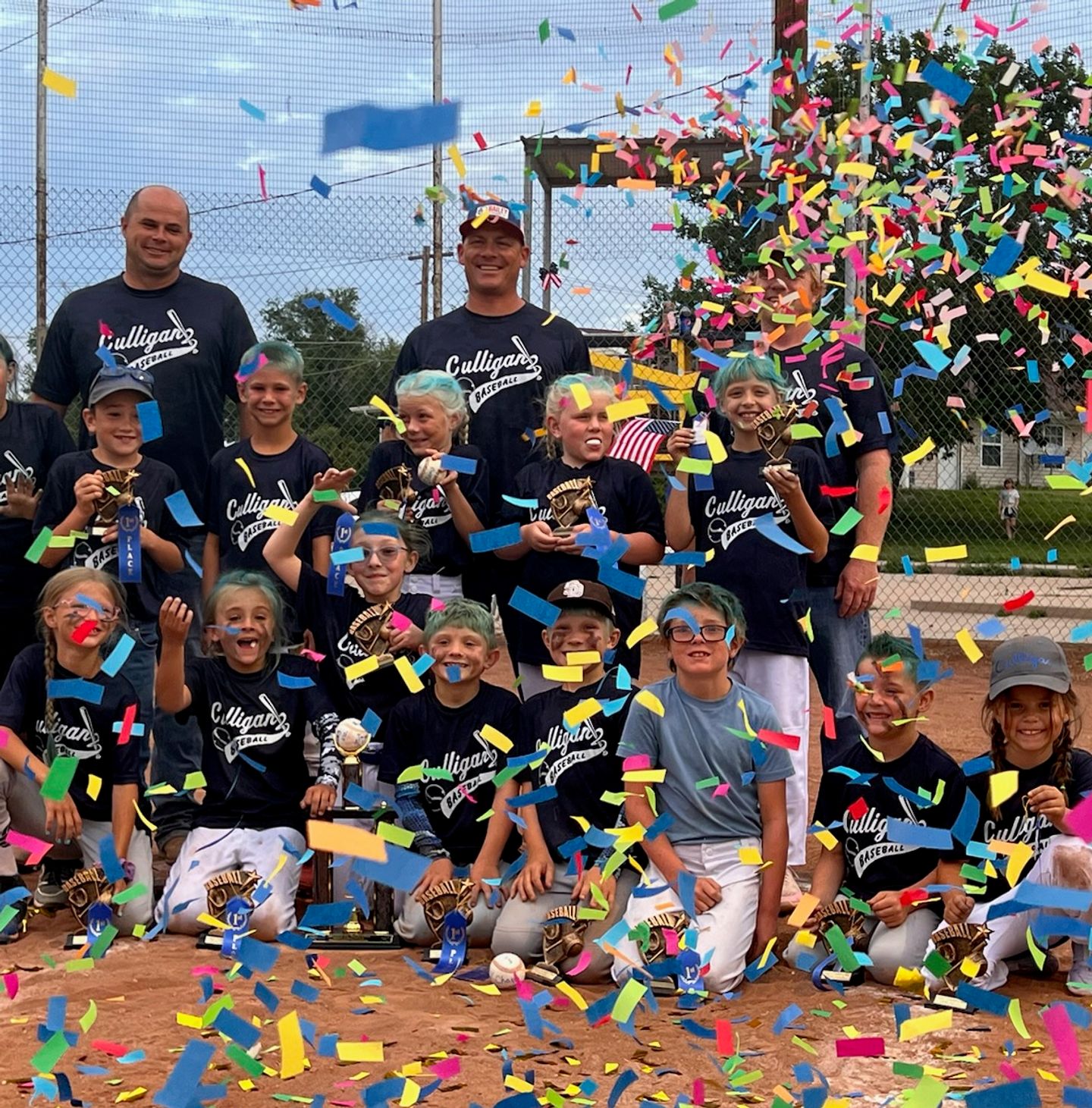 A Decatur County, KS youth baseball team celebrating