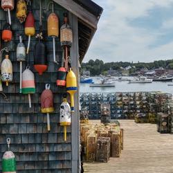 Colorful buoys decorate a fishing shack on the docks.