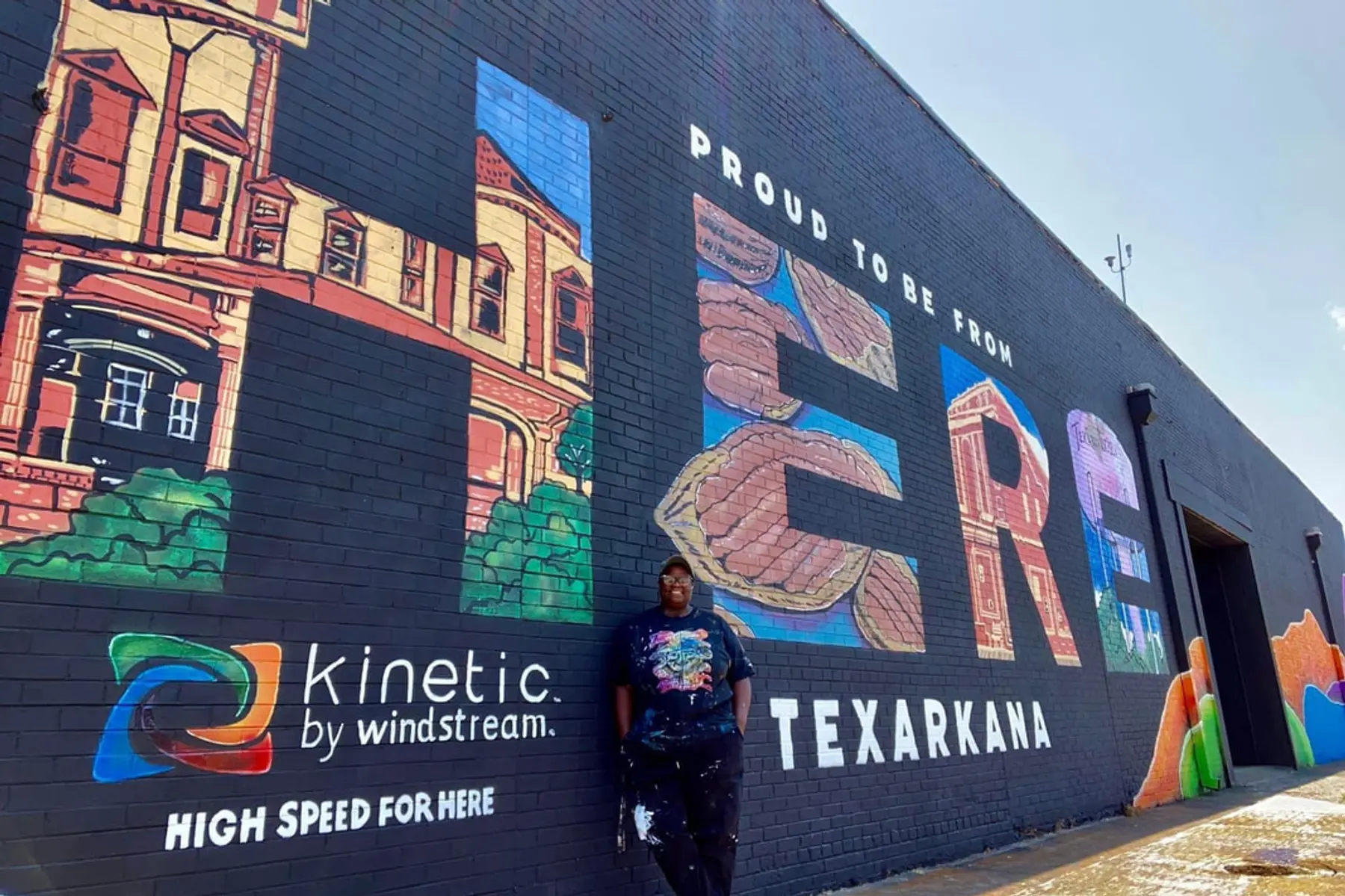 Photo of Resident in Front of Mural (Credit: Texarkana Main Street)