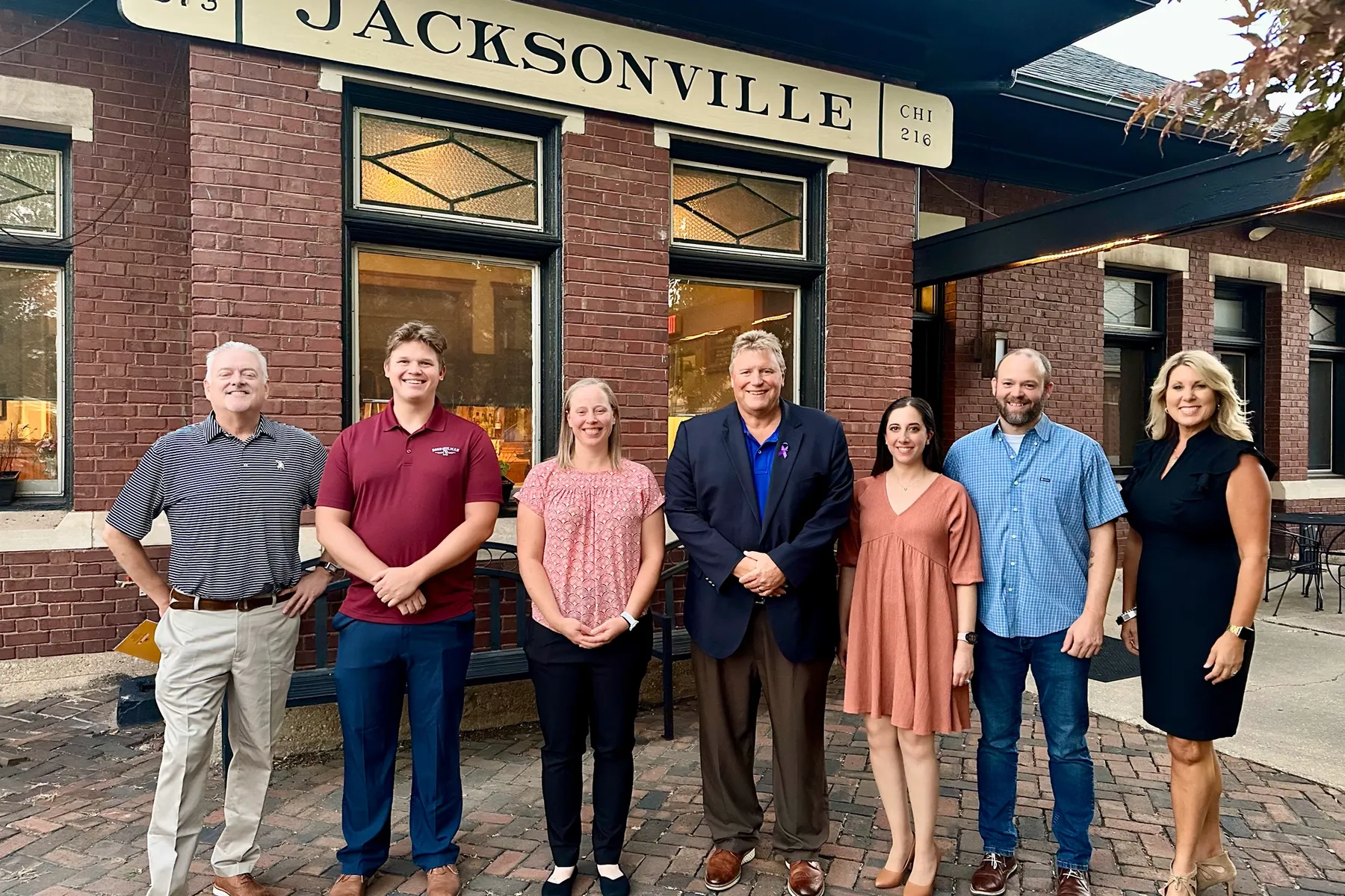 Successful applicants to the first round of the Jacksonville Region’s MakeMyMove program gathered at Jacksonville Regional Economic Development Corporation’s Investor Appreciation Event. Pictured left to right: Lance, Cade, Emma, Jacksonville Mayor Andy Ezard, Elena, Nathan and JREDC President Kristin Jamison.