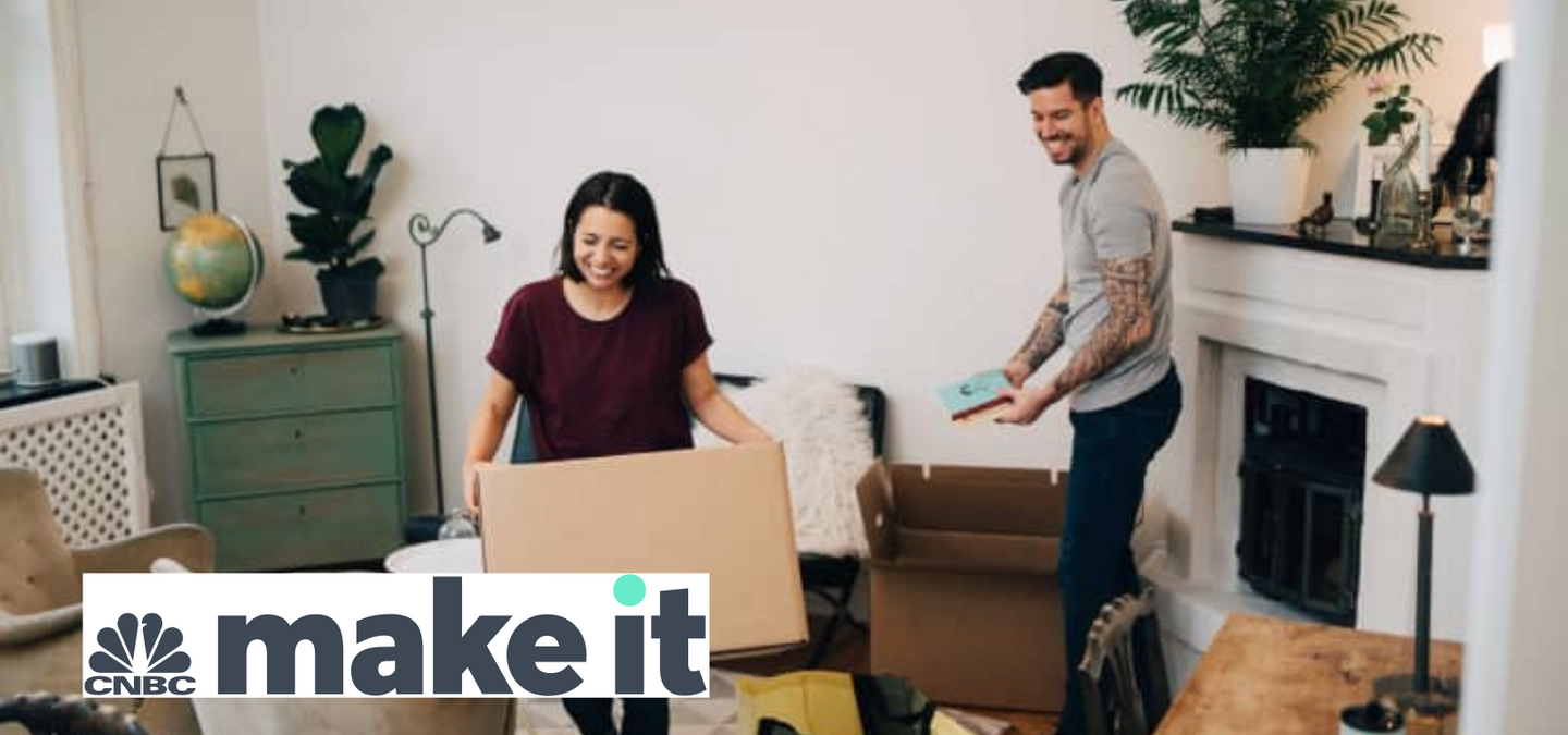 Getty Image. Man and woman unpacking moving boxes.