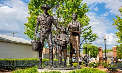 Centennial Park on Main Street is home to this bronze sculpture of an early 20th-century family. Photo credit: rawf8 / Shutterstock.com