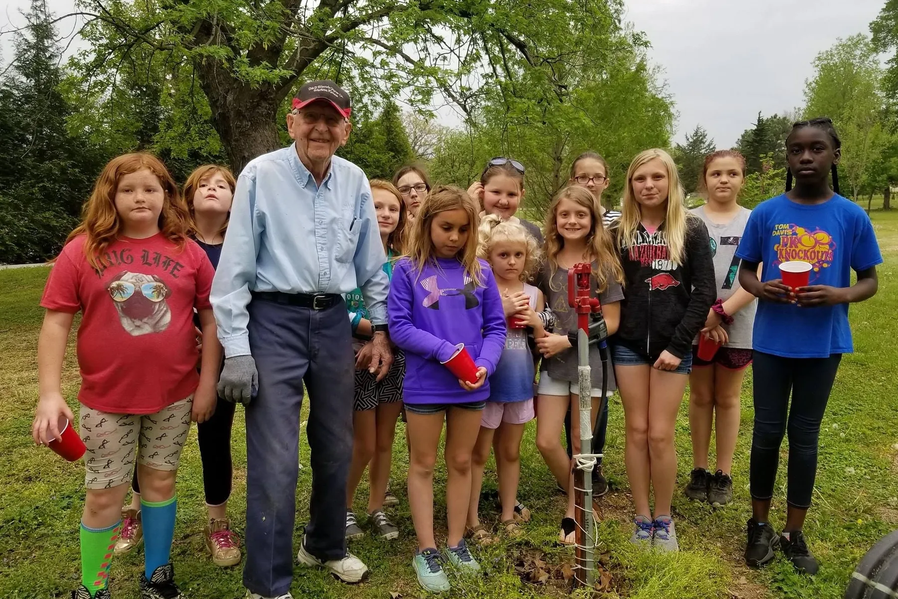 Kenny Ervin explaining an irrigation system to the Girl Scouts on Earth Day. Parsons Arboretum, Glenwood Park (Credit to Parsons, KS Public Information Office Facebook Page)