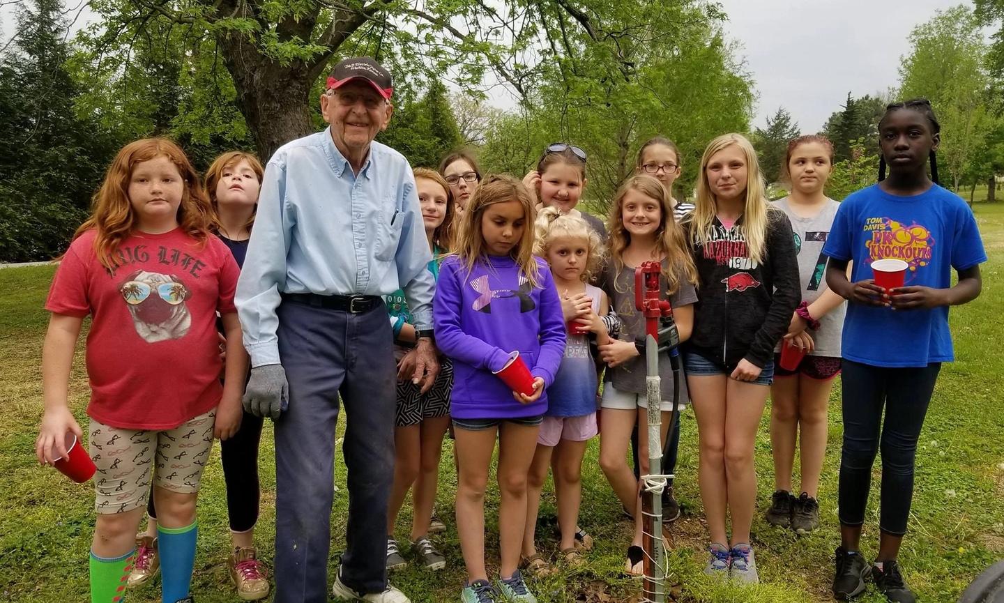 Kenny Ervin explaining an irrigation system to the Girl Scouts on Earth Day. Parsons Arboretum, Glenwood Park (Credit to Parsons, KS Public Information Office Facebook Page)
