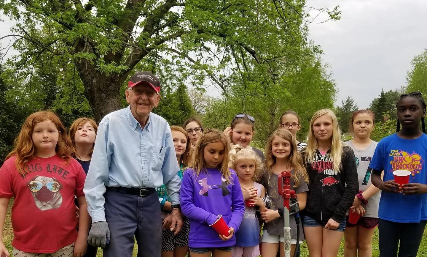Kenny Ervin explaining an irrigation system to the Girl Scouts on Earth Day. Parsons Arboretum, Glenwood Park (Credit to Parsons, KS Public Information Office Facebook Page)