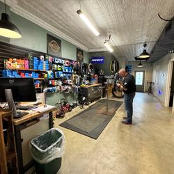 Colin Kuchy, the owner of Rural Cyclery, makes repairs to a custom bicycle in his shop in downtown Winchester.