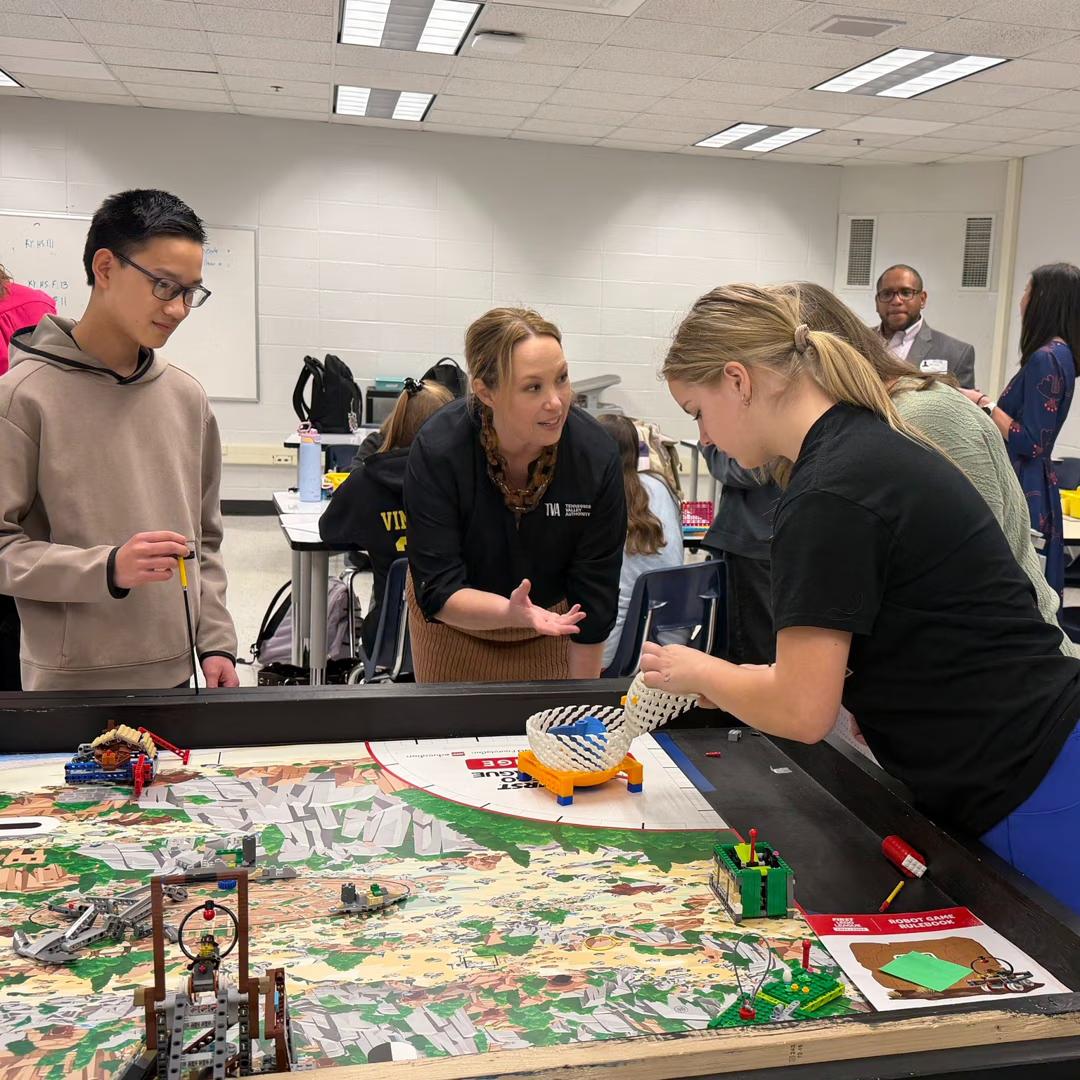 Students working with teacher on board game / simulation exercise (Credit: Warren County Schools)