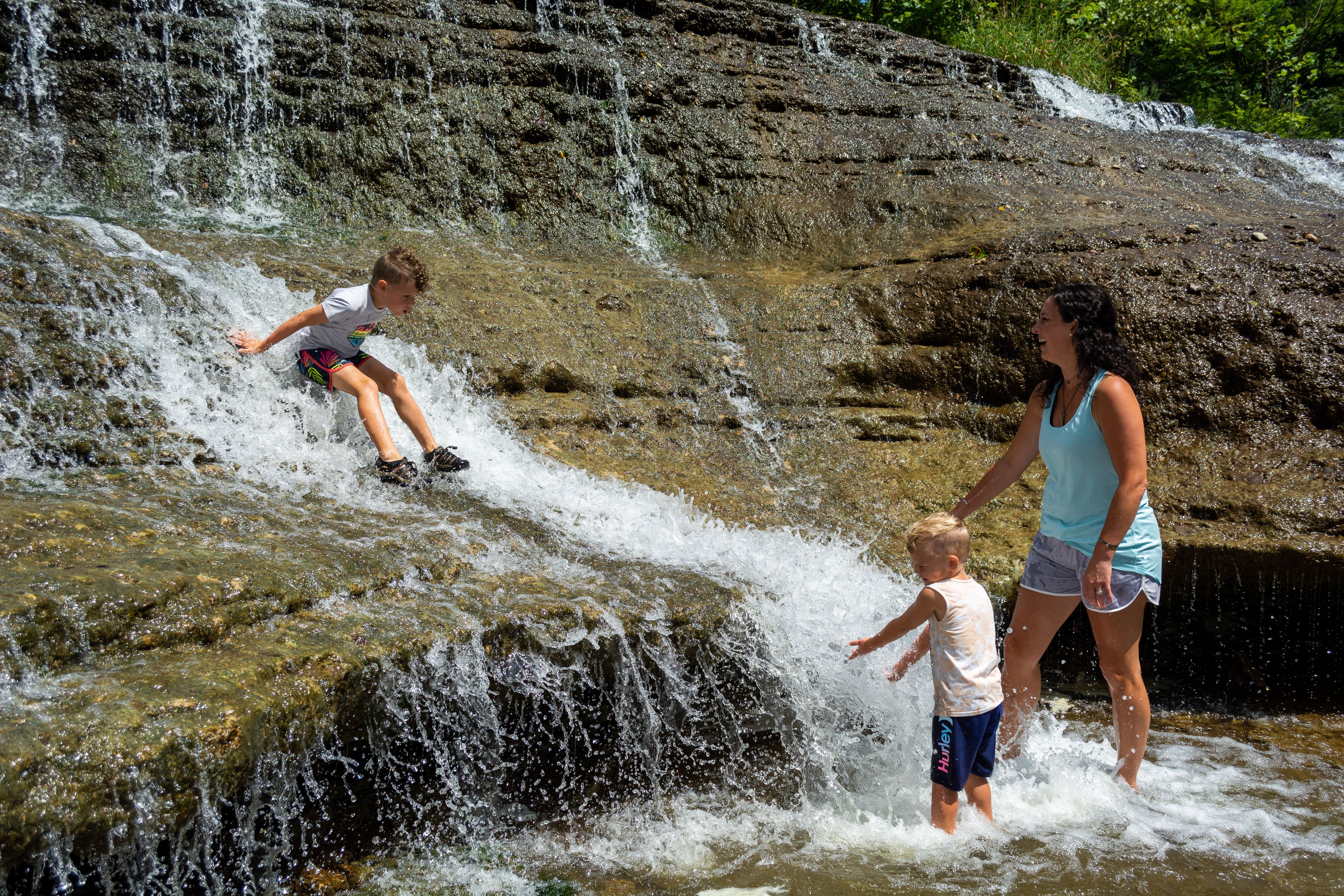 Families playing at Thistlewaite Falls