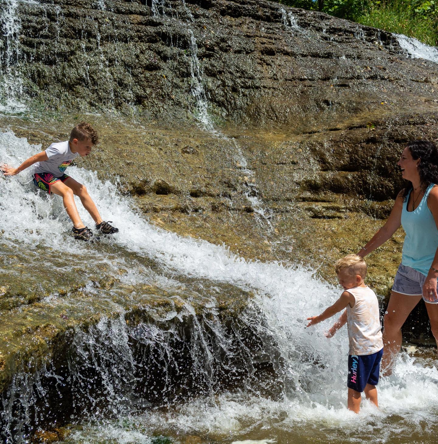 Families playing at Thistlewaite Falls