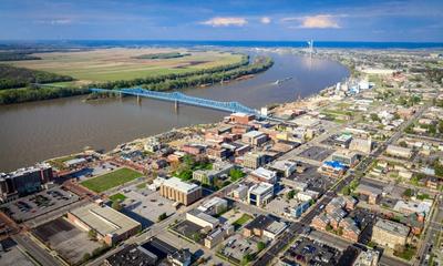 Aerial view of Downtown Owensboro with the historic Blue Bridge in the background. 
