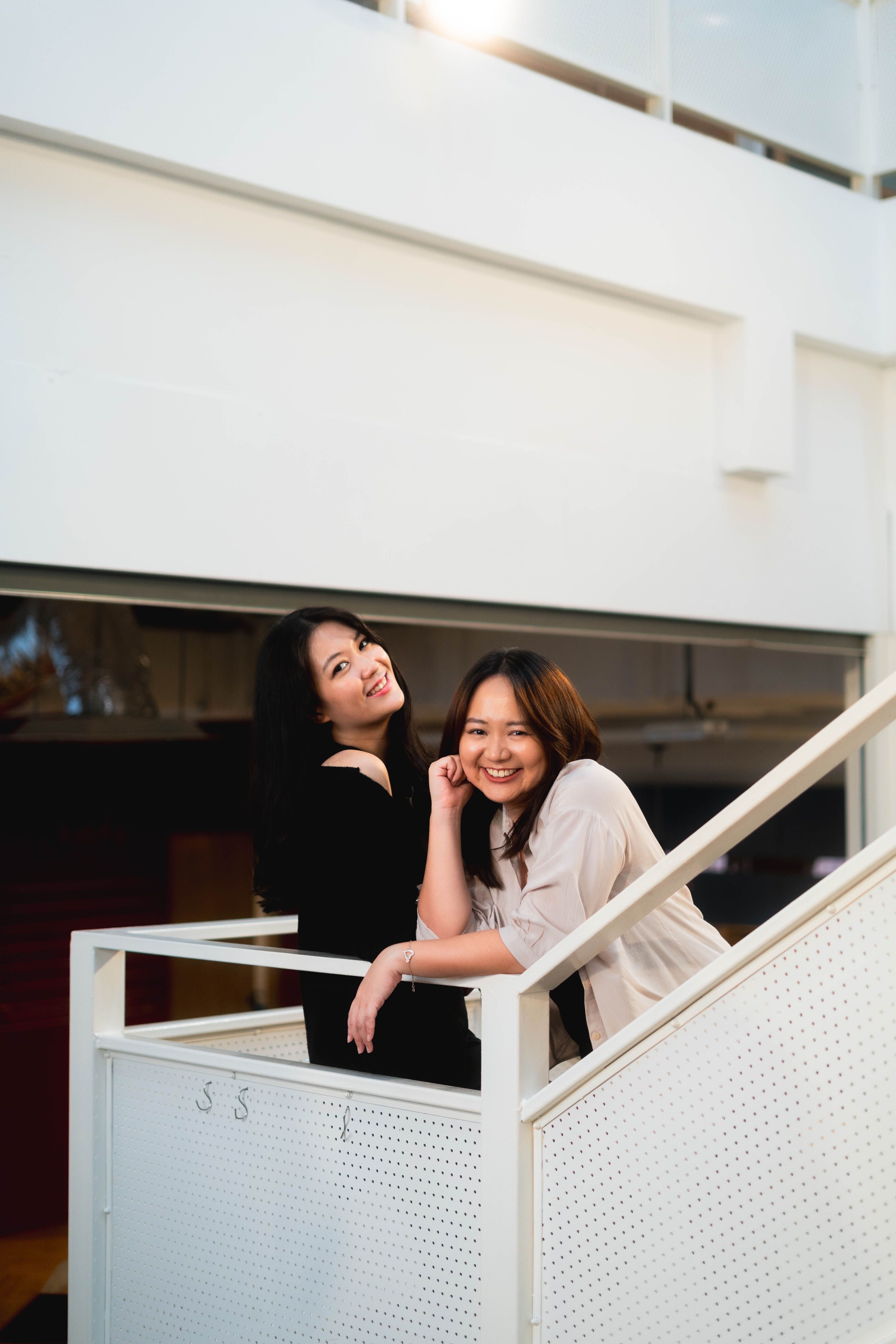 Cara Cara co-founders at the entrance to the centre, smiling