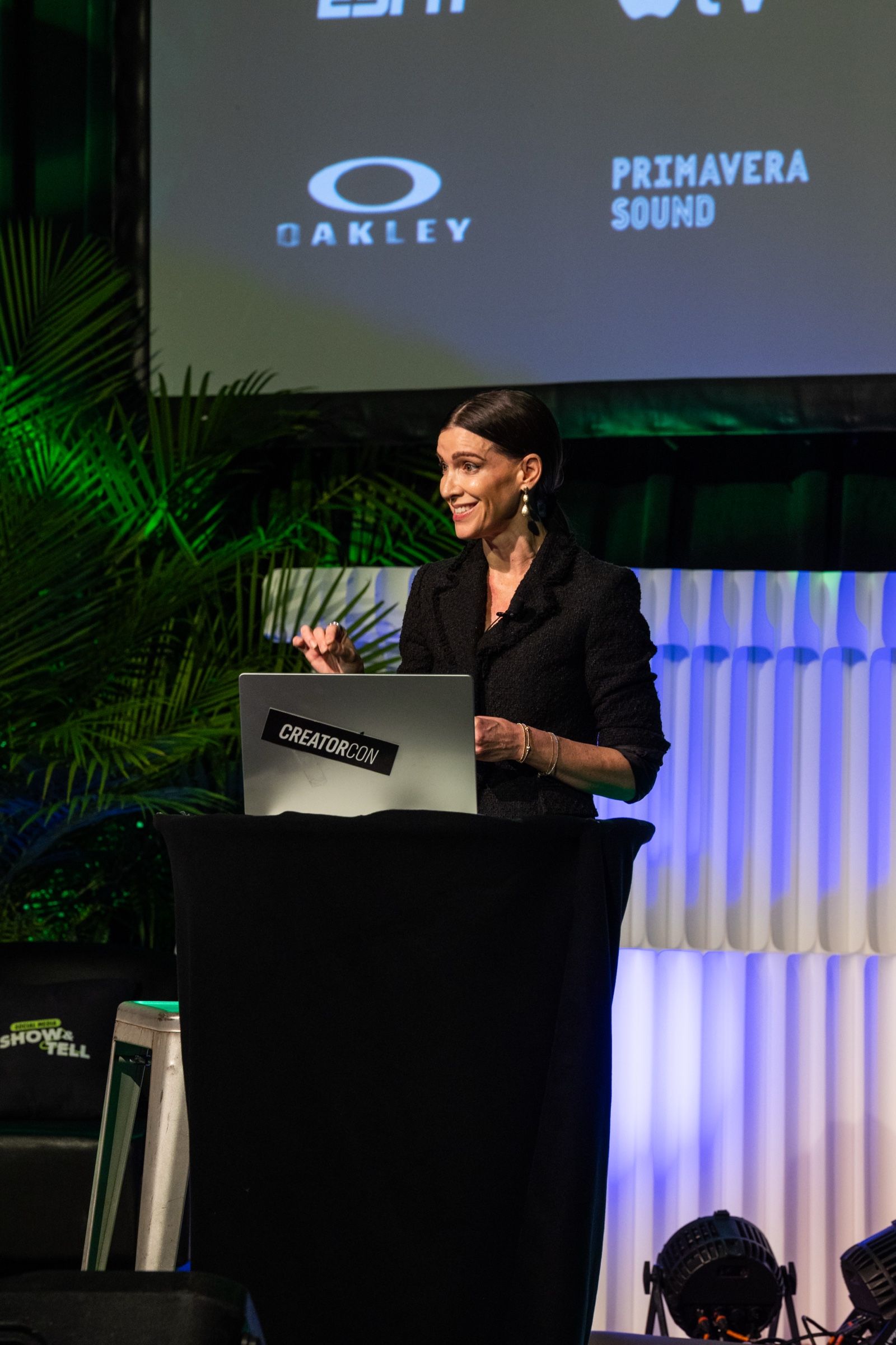 Megan G Wells speaking on stage