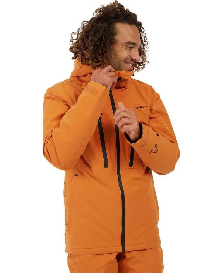 Man smiling in orange ski coat
