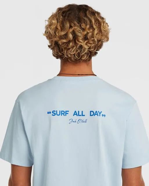 Young blonde man in surf all day shirt from behind
