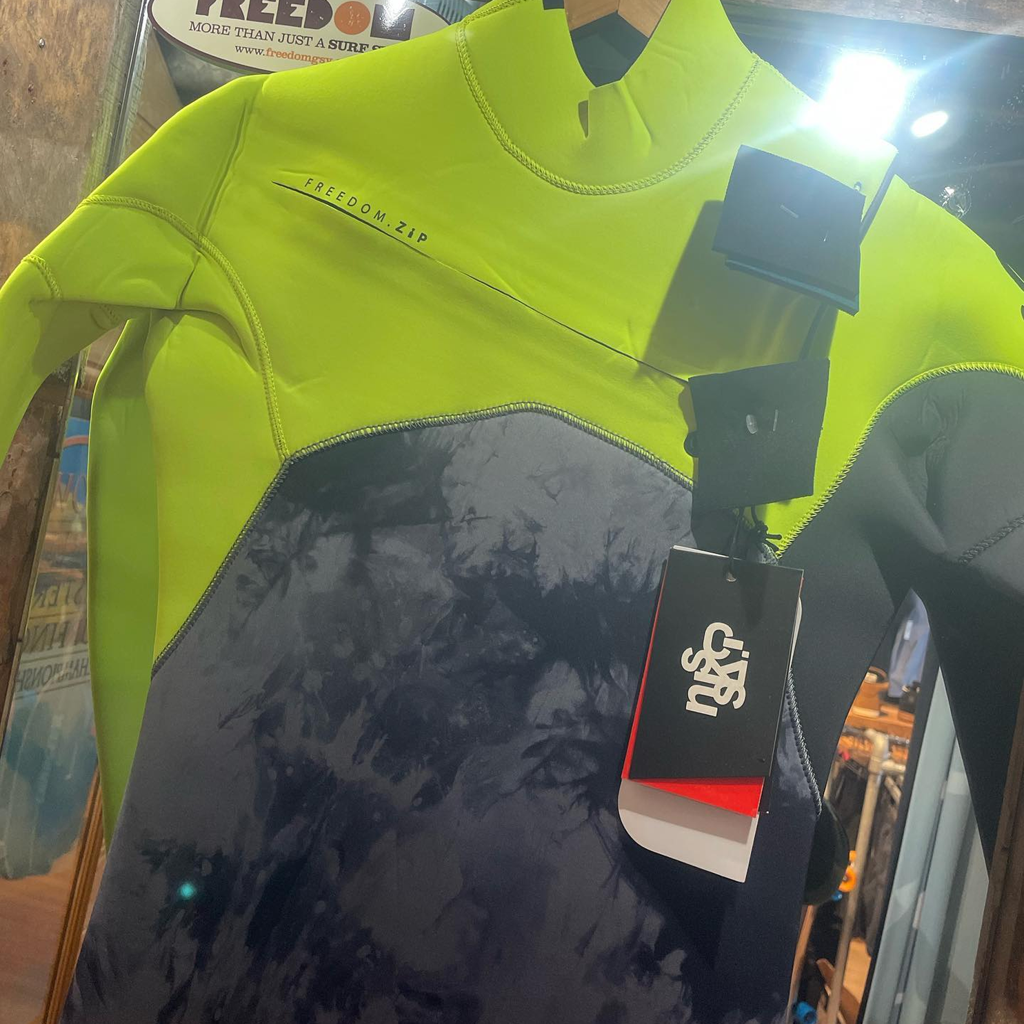 Close up of green and black wetsuit new with tag