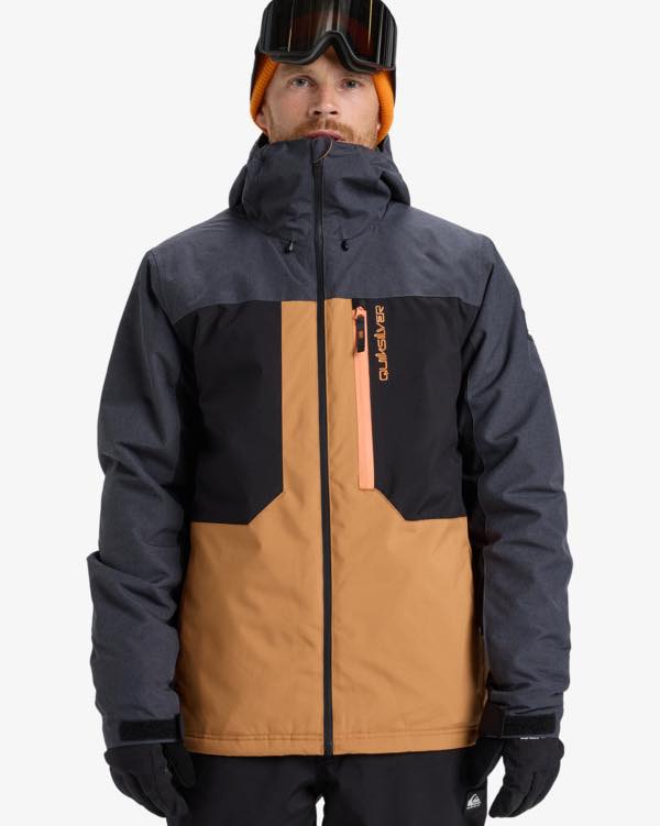 Man in ski goggles black and orange ski coat