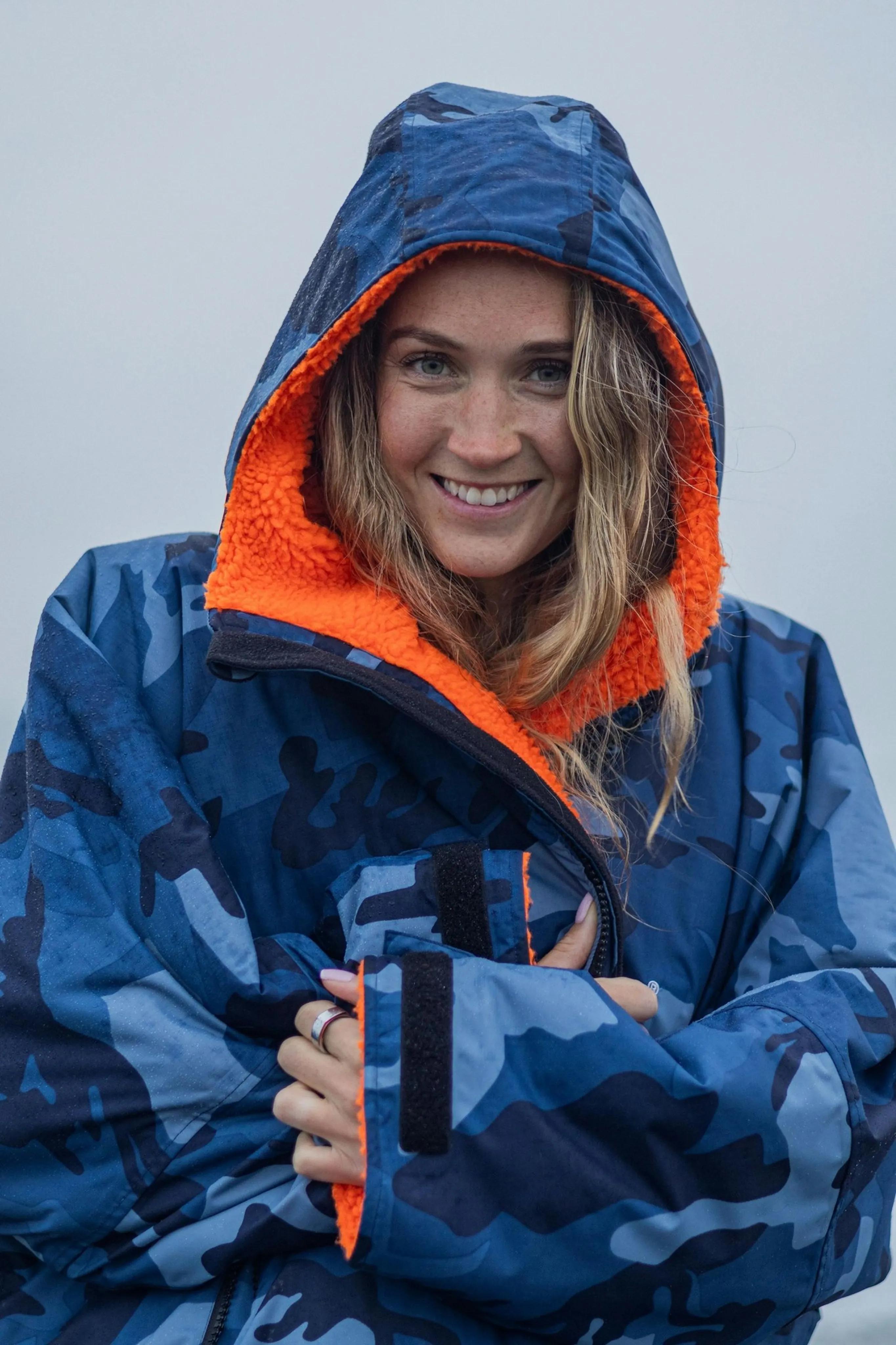 Woman in an orange and blue coat
