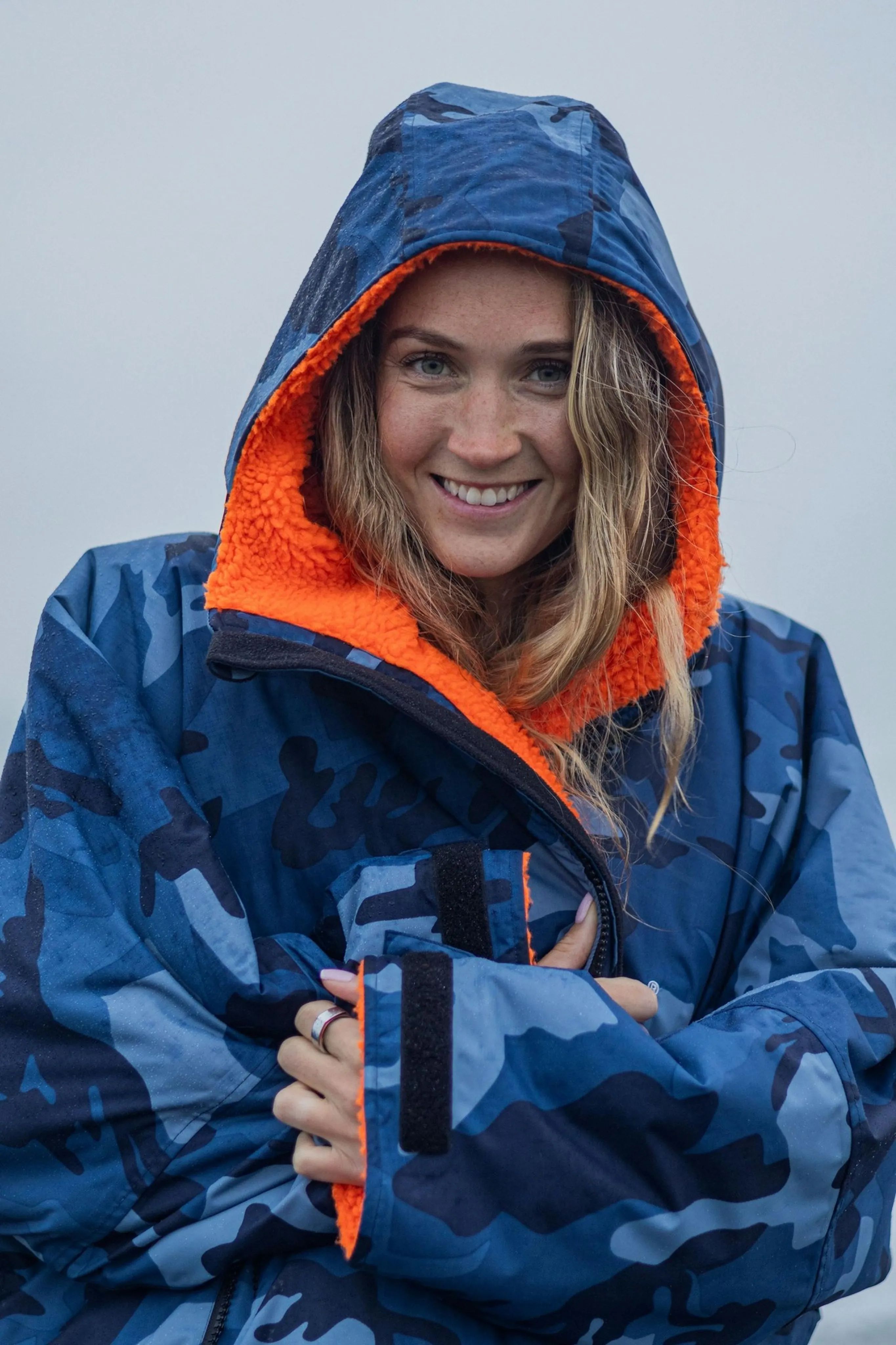 Woman in an orange and blue coat