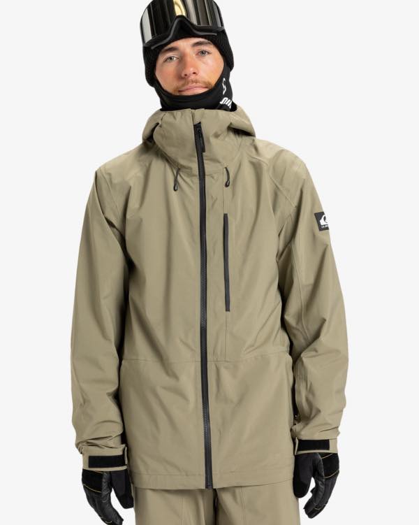 Man in goggles ski mask and burgundy ski coat