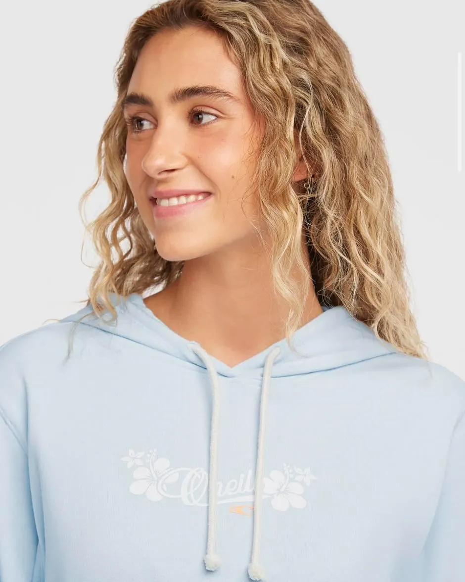 Woman looking away smiling in light blue O'Neill hoodie