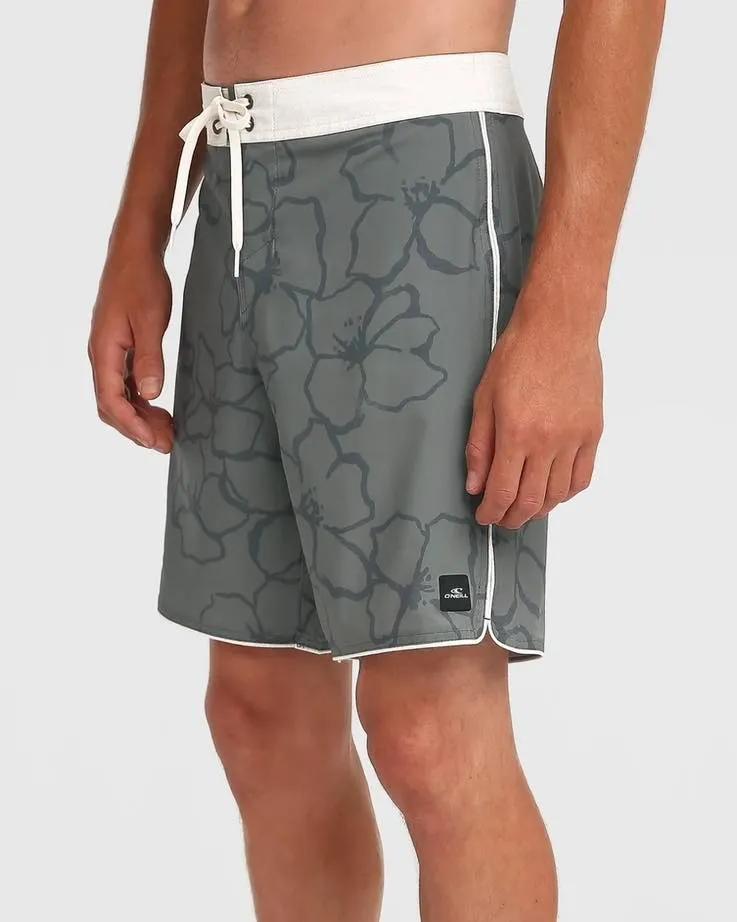 Close up of flower pattern grey shorts with white band